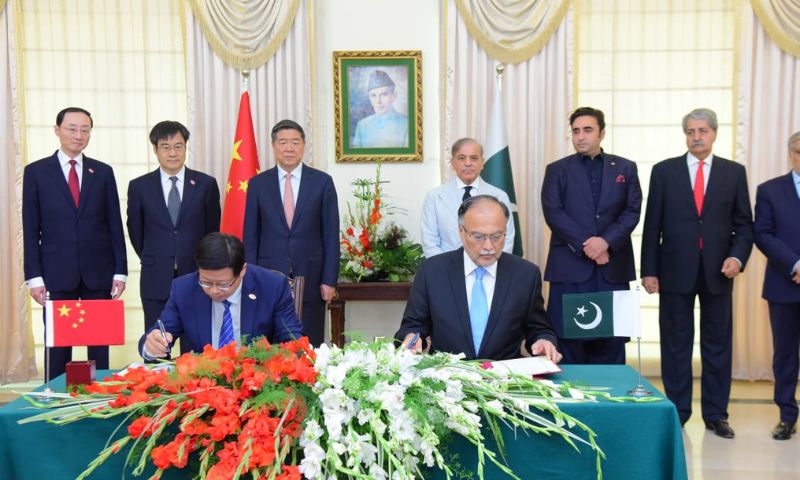 ISLAMABAD: In celebration of the 10-year anniversary of the multi-billion-dollar China-Pakistan Economic Corridor (CPEC) project, Pakistan and China have inked several Memorandums of Understanding (MoUs) during Chinse Vice Premier’s visit to Islamabad to boost bilateral cooperation and expand economic partnership between the two countries. The signing ceremony, which took place at the Prime Minister's Office, followed a meeting between Chinese Vice-Premier He Lifeng and Prime Minister of Pakistan, Muhammad Shehbaz Sharif. The high-level Chinese delegation, along with federal cabinet members and senior officials from various ministries, witnessed the signing event. The Chinese Vice-Premier is on a three-day official visit to Islamabad to celebrate the completion of the 10 years of the CPEC. The minutes of the 11th Meeting of the Joint Cooperation Committee (JCC) on CPEC were also signed in the high-level ceremony. This document outlined the decisions and outcomes of the eleventh Joint Cooperation Committee meeting held on October 27 last. It was signed by Mr. Cong Liang, Vice Chairman of the National Development and Reform Commission (NDRC) of China, and Ahsan Iqbal, the Federal Minister for Planning Development & Special Initiatives of Pakistan. Expert Exchange Mechanism MoU between Pakistan and China Among the other MoUs, one aimed to establish an Expert Exchange Mechanism within the Framework of the CPEC. The purpose of this MoU was to facilitate knowledge sharing between the Ministry of Planning, Development & Special Initiatives of Pakistan and the NDRC of China. The objective was to gain intellectual support and consultation for China-Pakistan capacity-building cooperation, conducting in-depth exchanges of Chinese experts with the Pakistani government and enterprises, and helping Pakistan meet international standards more effectively. This MoU was signed by Mr. Cong Liang and Ahsan Iqbal. Both sides also signed an MoU on the Protocol of Phytosanitary Requirements for Exporting Dried Chilies from Pakistan to China. The protocol outlined the phytosanitary requirements for exporting dried chilies from Pakistan to China and was signed by representatives from the General Administration of Customs of China and the Pakistan National Food Ministry. Furthermore, an MoU of the Realignment of the KKH Phase-II (Thakot-Raikot) Project was signed. Representatives from the Ministry of Transport of China and the National Highway Authority, Ministry of Communications of Pakistan, signed the document. Furthermore, a significant MoU was signed between the All-China Federation of Trade Unions (ACFTU) and the Board of Investment, Pakistan, under the ambit of CPEC Industrial Cooperation. This MoU aimed to foster workforce exchange programs associated with CPEC projects for skill development, technical training, language courses, and sharing Chinese experience in SEZs development. It further strengthened the Pak-China Industrial Cooperation and the development of SEZs through Chinese intellectual support. Lastly, an agreement on the Announcement of the Minutes of the 21st Conference of Technical Committees on Promoting the (ML-1) Project was also signed. The ML-1 project is an important project of the CPEC to transform the Pakistan Railway’s transportation system. Both countries have made significant strides in preliminary technical work, and the agreement signals their commitment to prompt work on this strategic initiative. 