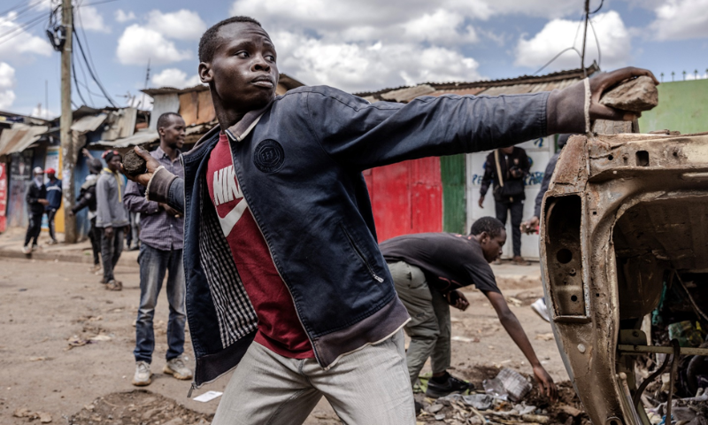 Opposition party supporters throw stones towards Police in Kenya