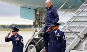 Biden Stumbles Again on Plane Amid Autoworkers Protest