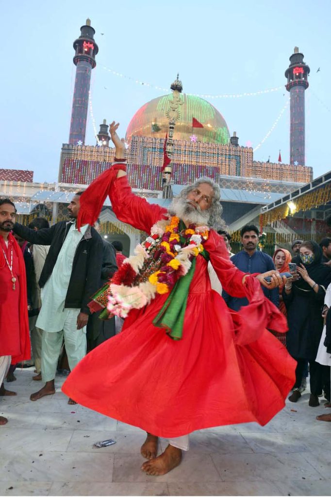 Devotees performing dhamal at the shrine of Hazrat Lal Shahbaz Qalandar on the occasion of 772nd Urs celebration in Sehwan. (Photo by APP)
