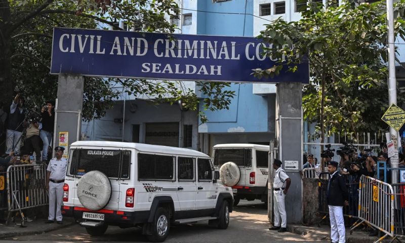 Police personnel stand guard at the entrance of the Civil and Criminal Court Sealdah in Kolkata on January 18, 2025. Dibyangshu Sarkar/AFP/Getty Images