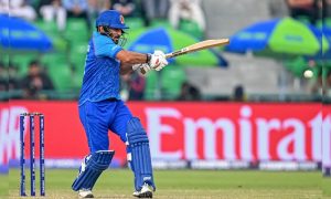 Afghanistan's Gulbadin Naib plays a shot during the ICC Champions Trophy one-day international (ODI) cricket match between Australia and Afghanistan at the Gaddafi Stadium in Lahore on February 28, 2025.