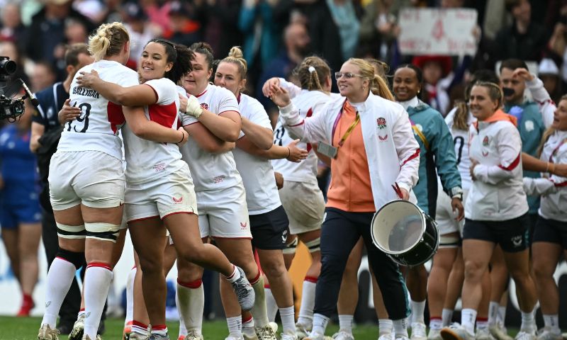 England's players celebrate on the field after the Women’s Rugby World Cup semi-final between France and England at Ashton Gate Stadium, Bristol, southwest England, on September 20, 2025. England won the game 35-17. (Photo by AFP)