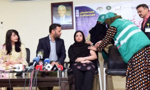 Lady Health Workers administering an HPV vaccine to the daughter of Federal Health Minister, Syed Mustafa Kamal, at the DRAP Office as part of efforts to counter propaganda against vaccination. (Photo by APP)