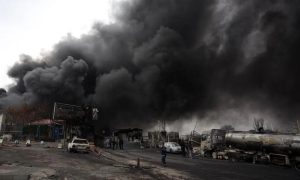 WHO Warns of Health Risks from ‘Black Rain’ After Strikes on Iran’s Oil Facilities