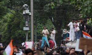 Modi Faces Challenge from 'Cockroach' Activists Over Surveillance at India Youth Protest